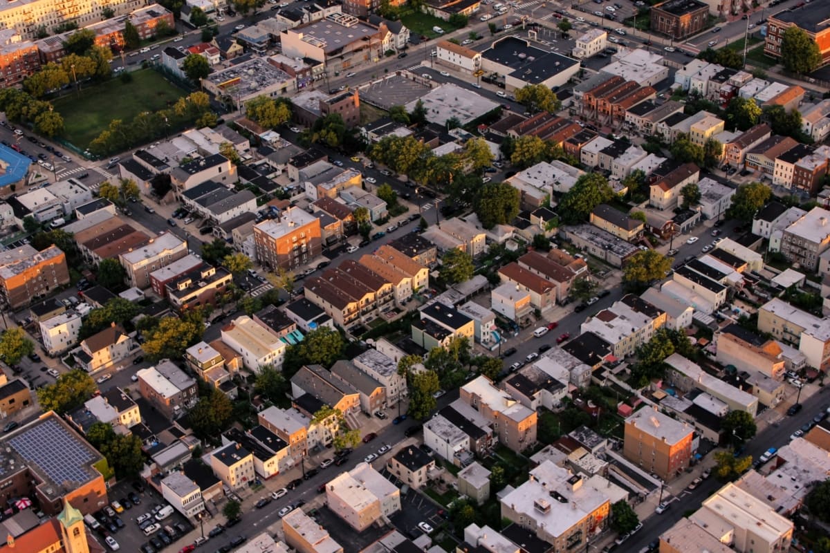 view of a town from above showing streets lined with buildings