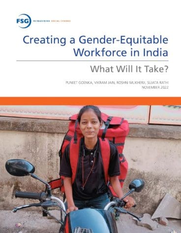 Woman on motor bike with backpack for delivering good representing women in the workforce in India
