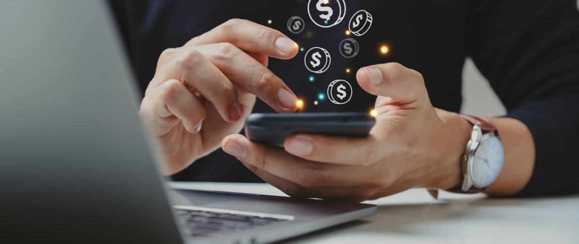 Hand of businessman using smart phone with coin icon. Hand of businessman using smart phone with coin icon,