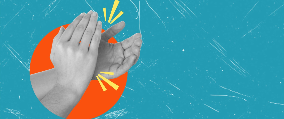 Photo of two hands clapping on a blue background